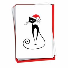 a card with a black cat wearing a santa's hat on top of it