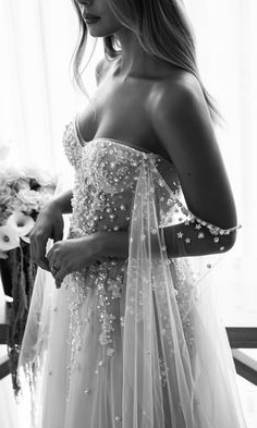 black and white photo of woman in wedding dress