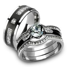 two wedding rings with black and white diamonds