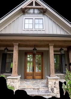 the front entrance to a house with stone steps