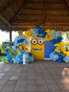 balloons and decorations are arranged in the shape of minion