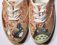 a pair of shoes with totoro and totoro on them