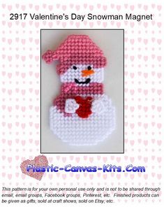 a cross stitch snowman ornament is shown in pink and white with the words, valentine's day snowman magnet