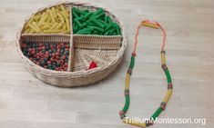 a basket filled with lots of different types of food next to a string of beads