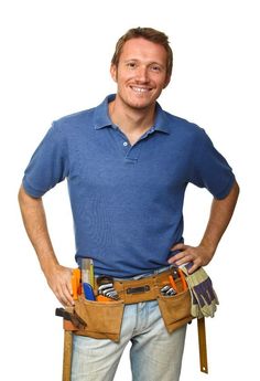 a man standing with his hands on his hips and holding tools in his pocket, smiling