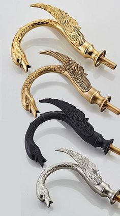 four different types of decorative handles and handles