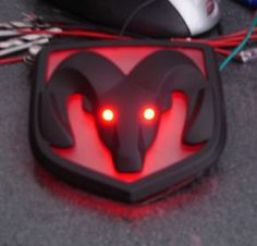 a close up of a mouse with red lights in the shape of an animal's head