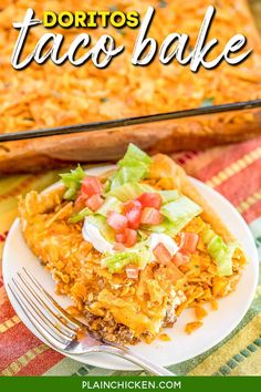 a close up of a plate of taco bake on a table with a fork