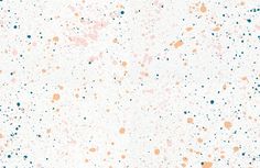 an abstract white background with orange, blue and black dots on it's surface