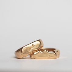 Oxbow's signature Kiss Rings come as a set of two. You can select two of the same size if you intend to wear them together, or choose two different sizes if you want to gift one or wear them on different fingers. Ring one is pictured on the bottom of the first photo & is the face with the nose. Details: Vermeil rings Original design carved in wax and cast Signet style *please note, the kiss rings have a thick band, and most people prefer to size up by 1/2 size. This is just a note, I always reco Handmade 14k Gold Stackable Promise Rings, Minimalist Hand Cast Gold Rings, Stackable Brass Rings For Wedding, Adjustable Recycled Gold Promise Rings, Brass Stackable Wedding Rings, Stackable Brass Wedding Rings, Minimalist Brass Promise Rings, Minimalist Hand Cast Rings As A Gift, Hand Cast Gold Rings For Gift