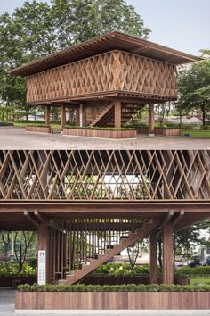 two different views of a wooden structure in the middle of a park with trees and bushes