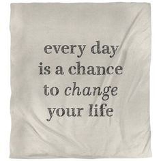 a blanket with the words every day is a chance to change your life