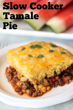 a white plate topped with a slice of slow cooker tamale pie