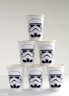 star wars cups are stacked up in the shape of stormtroopers