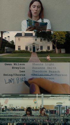 a woman holding a book in front of a building and another person writing on the wall