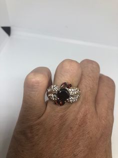 Vintage Red Bohemian Garnet White Sapphire 925 Sterling Silver Cocktail Statement Lovely Bohemian Garnet and white sapphire ring 925 Sterling silver Size 8 but can be re sized for you on request, my jeweler charges $10-$20 All rings are shipped in a nice gift box. Check out our over a THOUSAND great reviews Engraving is $4 per letter and is not always perfect depending on the piece. It can take a few days if the jeweler is busy. This is payable to Paypal Judithsltd@gmail.com Garnet Ring With Diamond Accents, Garnet Cluster Jewelry For Anniversary, Red Cluster Jewelry With Diamond Accents, Red Multi-stone Cubic Zirconia Jewelry, Red Multi-stone Cluster Jewelry, Silver Cocktail, Garnet Gem, White Sapphire Ring, Black Sapphire