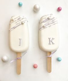 two ice cream pops with the letter k on them