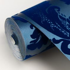 a close up of a blue tie on a white surface