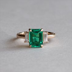 All things emeralds Emerald 3 Stone Ring, Emerald Gold Ring Vintage, Emerald Ring Vintage Gold, Three Stone Emerald Ring, Art Deco Emerald Engagement Ring, Diamond Ring With Emerald Accents, Emerald Cut Emerald Engagement Ring, Emerald Stone Engagement Ring, Diamond And Emerald Engagement Ring