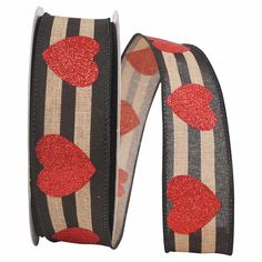 a pair of red hearts on black and white striped ribbon with silver foiled edges