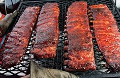 bbq ribs are being cooked on the grill