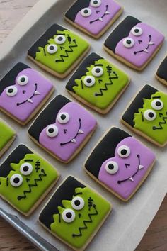 decorated cookies in the shape of monster faces