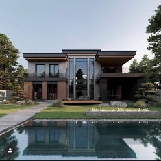 a modern house with a pool in the front yard