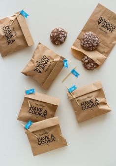 some cookies are sitting on top of brown paper bags with the words, let's make some cookie gifts