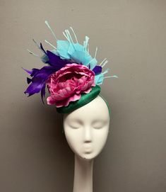 This bold fascinator is perfect for horses races, bridal showers, tea parties, hat luncheons or any other special event.  ► Want it now? Click the "Buy it now" button. ► Love it and want to buy later? Click on the button that says "♥ Favorite" ► Special request/contact me? Click the "Ask a question" link on the right. ► All Sales Are Final. Please contact me before purchasing if you have any questions. ► My shop policies: https://www.etsy.com/shop/tinselandtonic/policy?ref=shopinfo_policies_leftnav Thanks for visiting Tinsel and Tonic!! Please visit my other shops - wrapmeinfur.etsy.com for all your faux fur scarf needs  and abitoftinsel.etsy.com for one of a kind statement jewelry Fitted Evening Hair Accessories For Kentucky Derby, Fitted Headband For Kentucky Derby, Formal Hair Accessories With Handmade Flowers For Kentucky Derby, Evening Headpiece With Pinched Crown For Kentucky Derby, Evening Pinched Crown Headpiece For Kentucky Derby, Kentucky Derby Party Headband Fascinator, Summer Hair Accessories With Handmade Flowers, Fitted Summer Hair Accessories With Handmade Flowers, Fitted Headpieces For Kentucky Derby And Parties