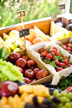 an assortment of fresh fruits and vegetables on display