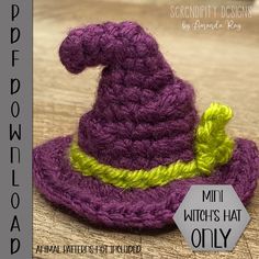 a purple crocheted hat with a yellow ribbon around the brim is sitting on a wooden surface