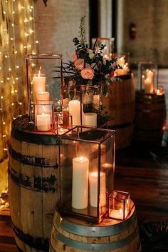 candles are lit on top of a barrel