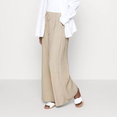 Crinkle Textured Pull-On Pants In The Color Cream. Size Is Xs Short. Ultra-High Rise Wide Leg Pants In A Breezy, Crinkle Textured Fabric, Featuring A Pull-On Style Elasticated Waistband And Functional Drawcords For Comfort And Adjustability. Brand New With Tags. Open To Offers! Lining:100% Viscose / Body:85% Viscose, 15% Nylon Turn Garment Inside Out Machine Wash Cold, With Like Colors Only Non-Chlorine Bleach Line Dry Do Not Iron Do Not Dry Clean Beige Viscose Pants For Spring, Spring Beige Viscose Pants, Casual Wrinkled Wide Leg Bottoms, Beige Viscose Bottoms For Summer, Beige Viscose Summer Bottoms, Spring Wide-leg Pants With Crinkle Texture, Casual Beige Viscose Bottoms, Spring Wide-leg Crinkle Texture Pants, Summer Loungewear Bottoms With Crinkle Texture