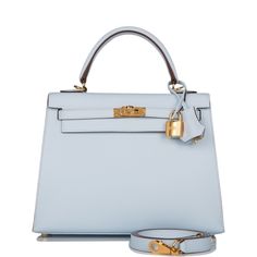 Photos are a representation of the bag sourced. This Kelly, in the Sellier style, is in Bleu Brume epsom leather with gold hardware and has tonal stitching, front flap, two straps with center toggle closure, clochette with lock and two keys a single rolled handle and removable shoulder strap.The interior is lined with Bleu Brume chevre leather and has one zip pocket with an Hermes engraved pull and one open pocket on the opposite side.Origin: FranceCondition: Pristine; new or never (plastic on h Evening Epsom Leather Bag With Lock, Evening Bags With Lock In Epsom Leather, Chic Epsom Leather Bag With Lock, Gold Epsom Leather Bag With Lock, Blue Epsom Leather Bag With Gold-tone Hardware, Top Handle Bags In Epsom Leather With Lock, Top Handle Epsom Leather Bag With Lock, Epsom Leather Top Handle Bags With Lock, Blue Bags With Lock For Formal Occasions