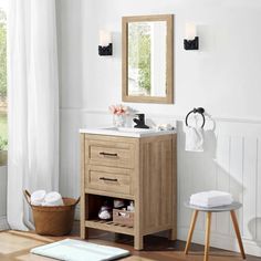 a bathroom with a sink, mirror and stool