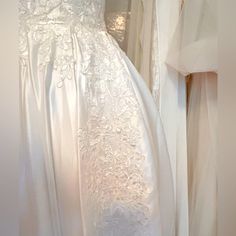 there is a white wedding dress on display