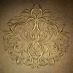 an intricate design on the wall in a room