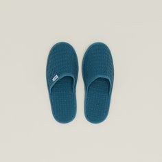 SLIPPER INTO SOMETHING COMFY Available n 3 sizes, with a grippy non-slip outsole Small: 10.5"L x 4"W; Women's 6-8; Men's 5 or below Medium: 11.25"L x 4.5"W; Women's 8-10; Men's 5-9 Large: 12"L x 4.5"W; Women's 11 or above; Men's 10-14 Oeko-Tex Standard 100 certified 370 gsm weight Part of our Simple Waffle Collection Cushy and padded for ultimate lounging You might never leave the house again (and we don't blame you) Waffle Slippers, Daybed Lounge, Bar Cups, Pendant Ceiling Lamp, Area Rug Runners, Candle Box, Bedside Tables Nightstands, Small Moments, Bookcase Shelves