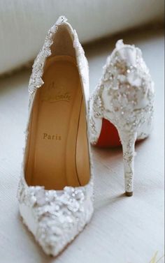 two pairs of white shoes with sequins on them