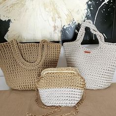 three straw bags sitting next to each other