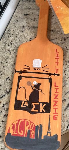 a wooden board with an image of a mouse on it