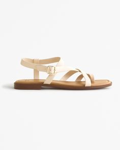 Step into effortless style with the Abercrombie & Fitch Women's Strappy Slide Sandals in a chic cream color. Designed for versatility and comfort, these sandals are the perfect addition to your wardrobe for any occasion.

- Size: 6
- Color: Cream
- Material: Upper: Polyurethane, Lining: Vegan Leather
- Heel Height: 0.3125 inches
- Upper Width: 2.4375 inches
- Gender: Female
- Age Group: Adult

Crafted with a focus on both fashion and function, these sandals feature a minimalist strappy design th Staple Shoes, Slide Sandals, Womens Swimwear, Abercrombie Fitch, Vegan Leather, Womens Sandals, Heel Height, The Beach, Dress Up