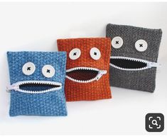 three crocheted bags with faces on them, one has eyes and the other has teeth