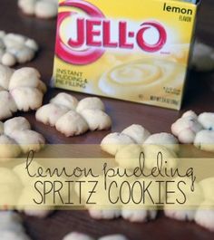 a box of jello sitting on top of a table next to some white cookies