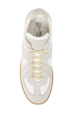 Based on a '70s Austrian sport shoe, this low-top sneaker features signature numerical debossing at the tongue and a single white basting stitch at the back. Style Name:Maison Margiela Replica Low Top Sneaker (Men). Style Number: 6265055. Basting Stitch, Maison Margiela Replica, Margiela Replica, Sport Shoe, Mens Designer Shoes, Sneaker Men, Sneakers Blue, Sneakers White, Mens Shoes Sneakers