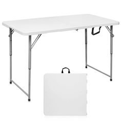 a white table with two legs and a sign on the bottom, next to it