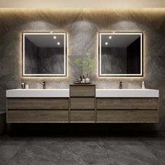 a bathroom with two sinks and mirrors on the wall