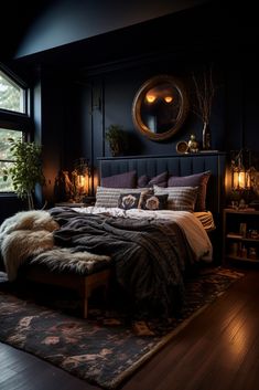 a bedroom with black walls and wooden floors, a bed covered in blankets and pillows