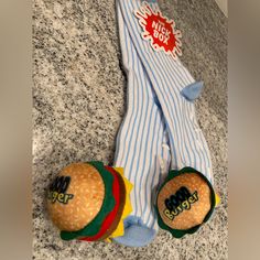 two hamburgers with socks on them sitting next to each other