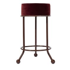 a stool with wheels and a velvet seat